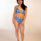 girl in blue floral triangle bikini top and high hip high waist bikini bottoms