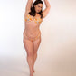 woman wearing a reversible orange / orange print high hip thong bikini bottoms and underwire top 