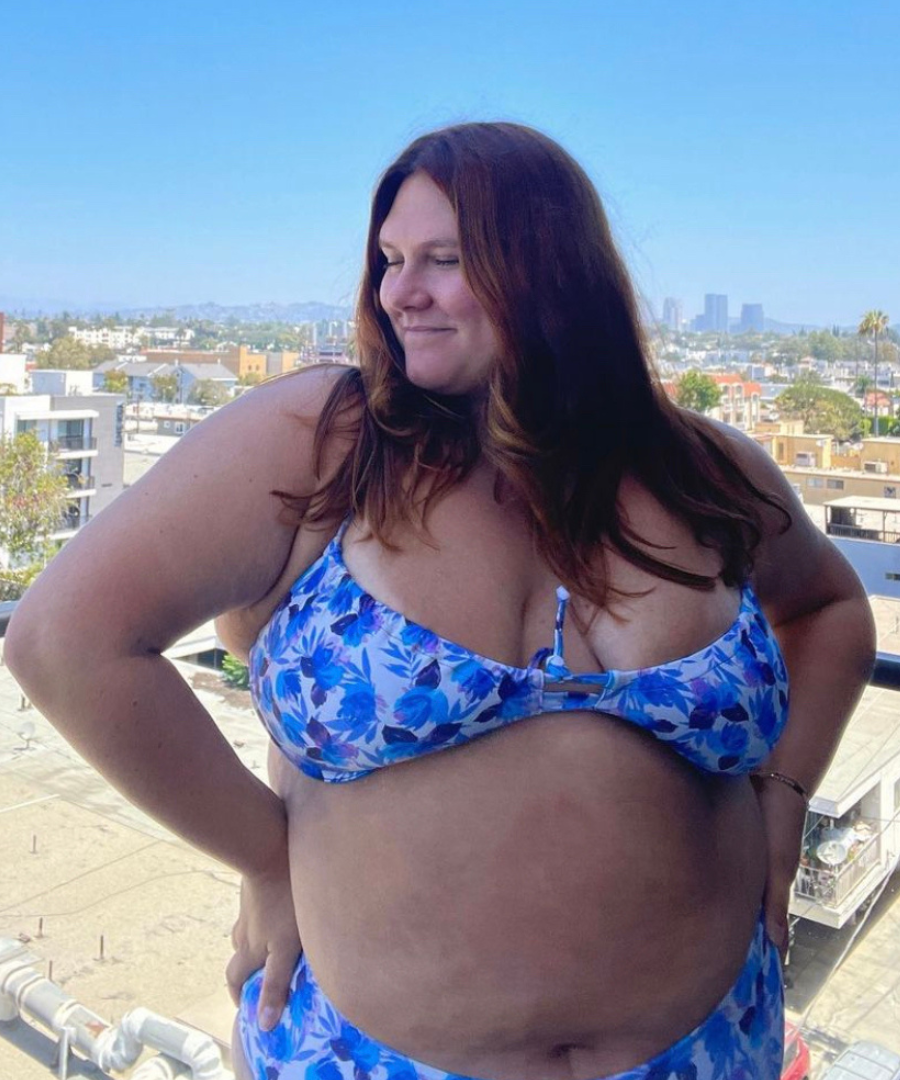 plus sized woman in blue floral underwire bikini top and matching high waisted bottoms