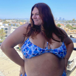 plus sized woman in blue floral underwire bikini top and matching high waisted bottoms