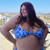 plus sized woman in blue floral underwire bikini top and matching high waisted bottoms