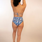 Blue floral bikini top double tied in back with mid coverage high waisted bikini bottoms