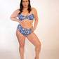 plus sized woman in blue floral underwire bikini top and matching high waisted bottoms