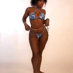 woman in blue floral side tie thong bikini bottoms and matching triangle top