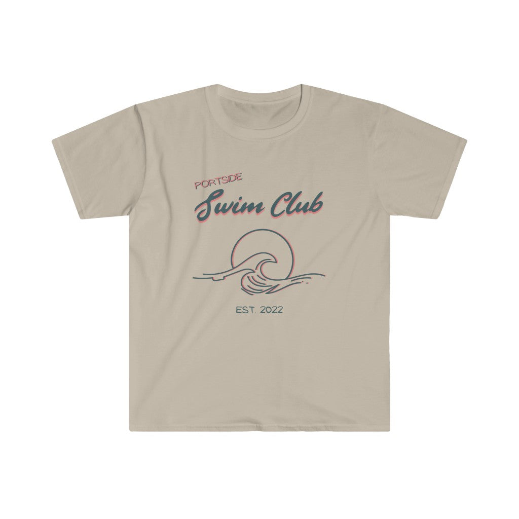 short sleeve, sand colored tshirt with a graphic of a wave in front of a circle with the words "Portside swim club" above it