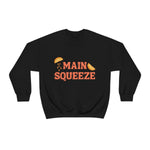 black crewneck sweatshirt with a graphic that says "main squeeze" in orang font with graphics of orange slices