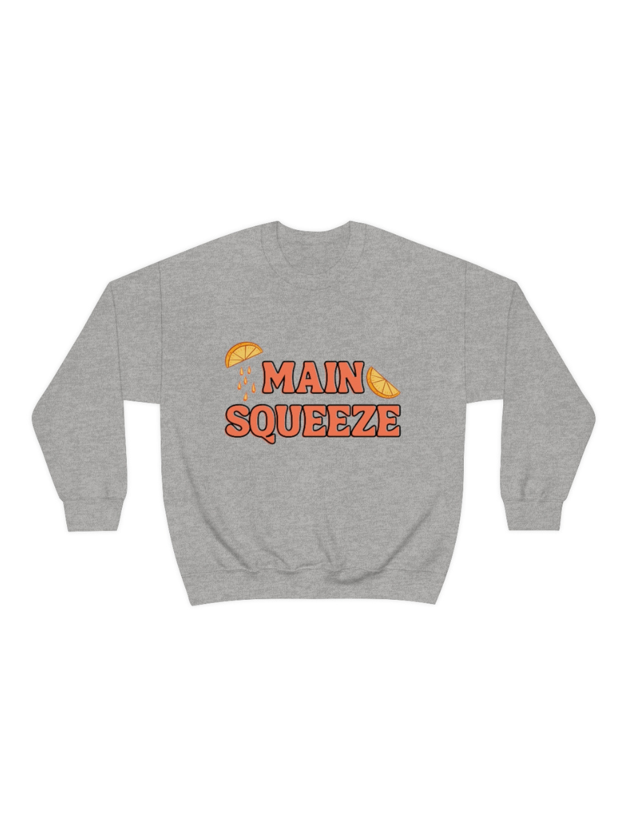 grey crewneck sweatshirt with a graphic that says "main squeeze" in orang font with graphics of orange slices