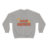 grey crewneck sweatshirt with a graphic that says "main squeeze" in orang font with graphics of orange slices